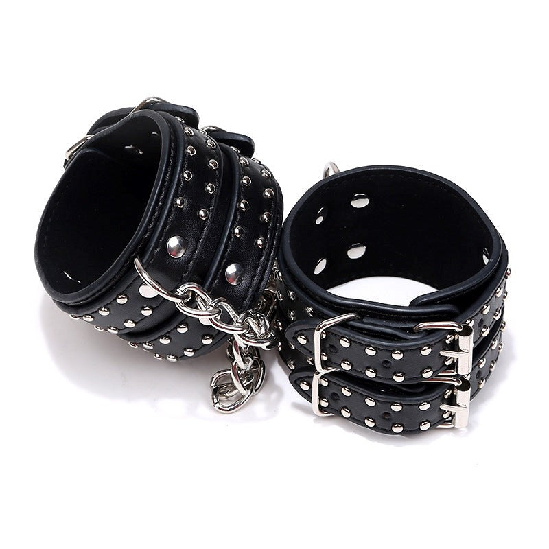 Studded Wrist Cuffs With Chain - - Rabbit Vibrators