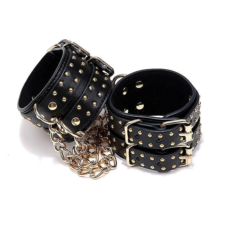 Studded Wrist Cuffs With Chain - Rabbit Vibrators
