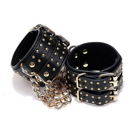 Studded Wrist Cuffs With Chain - Rabbit Vibrators