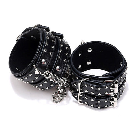 Studded Wrist Cuffs With Chain - Rabbit Vibrators