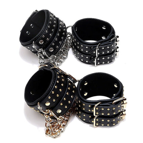 Studded Wrist Cuffs With Chain - Rabbit Vibrators